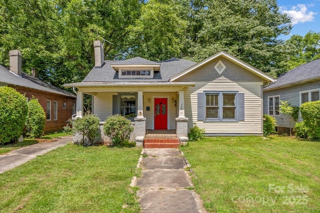 524 W Horah St, Salisbury, NC 28144 - bungalow with a front yard, a porch, a chimney, and roof with shingles