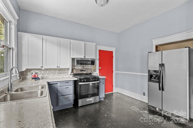 524 W Horah St, Salisbury, NC 28144 - kitchen featuring appliances with stainless steel finishes, white cabinets, tasteful backsplash, wainscoting, and light countertops