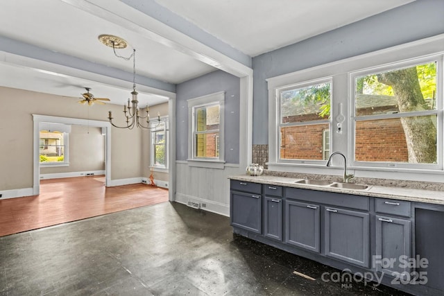 524 W Horah St, Salisbury, NC 28144 - kitchen with gray cabinetry, healthy amount of natural light, and a chandelier