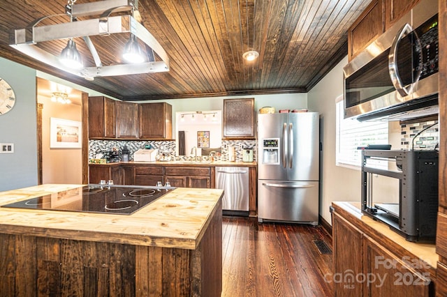 166 Duke St, Granite Falls, NC 28630 - kitchen featuring appliances with stainless steel finishes, butcher block countertops, dark wood-type flooring, decorative backsplash, and wood ceiling