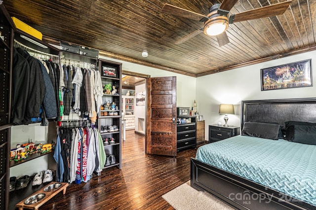 166 Duke St, Granite Falls, NC 28630 - bedroom featuring hardwood / wood-style flooring, crown molding, wooden ceiling, a closet, and a ceiling fan