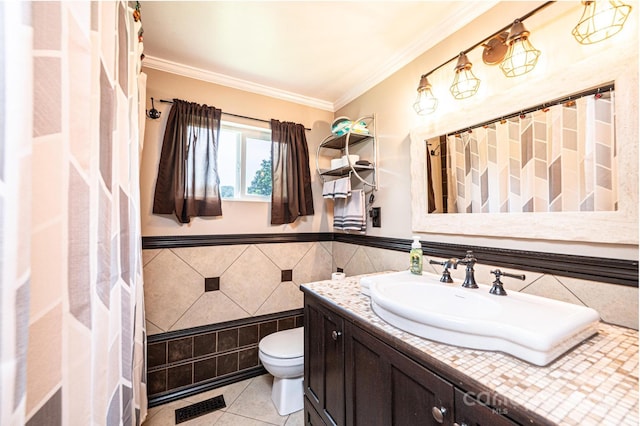 166 Duke St, Granite Falls, NC 28630 - full bathroom with tile patterned flooring, crown molding, vanity, tile walls, and a wainscoted wall