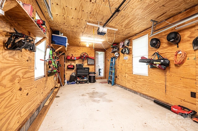 166 Duke St, Granite Falls, NC 28630 - garage featuring wood walls and a garage door opener