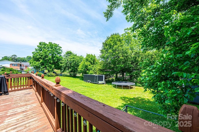 166 Duke St, Granite Falls, NC 28630 - wooden deck with a trampoline, a yard, and a pool