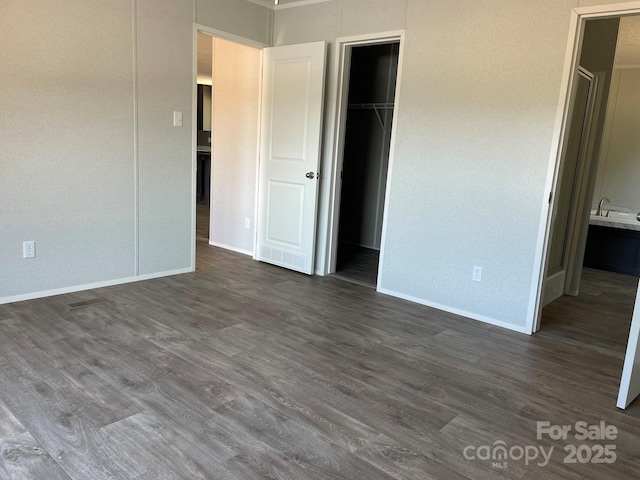 4172 Tallent Rd, Morganton, NC 28655 - unfurnished bedroom with dark wood-style floors, a spacious closet, and connected bathroom