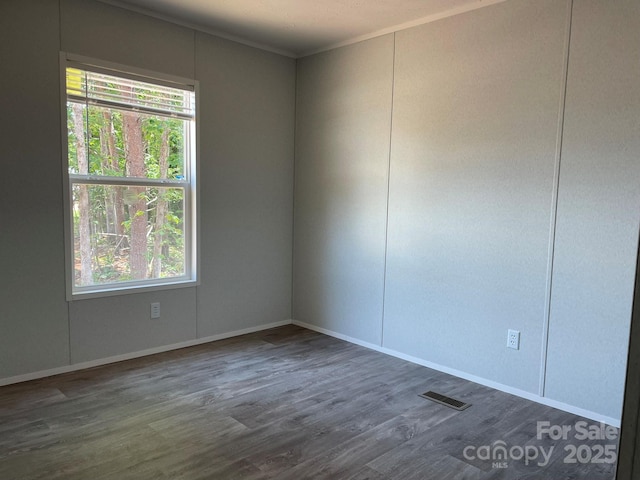 4172 Tallent Rd, Morganton, NC 28655 - empty room featuring wood finished floors, plenty of natural light, and crown molding