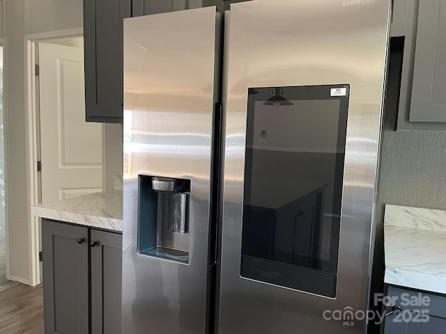 4180 Tallent Rd, Morganton, NC 28655 - kitchen featuring stainless steel refrigerator with ice dispenser, light countertops, gray cabinetry, and wood finished floors