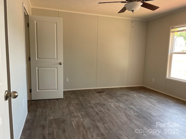 4180 Tallent Rd, Morganton, NC 28655 - unfurnished room featuring ceiling fan, crown molding, and dark wood-type flooring