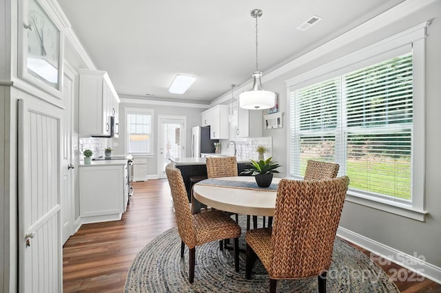 11359 Deer Ridge Ln, Charlotte, NC 28277 - dining area featuring dark wood finished floors and crown molding