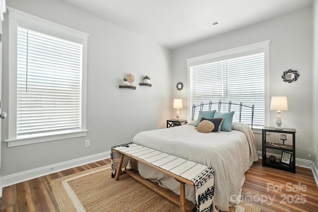 11359 Deer Ridge Ln, Charlotte, NC 28277 - bedroom featuring wood finished floors and multiple windows