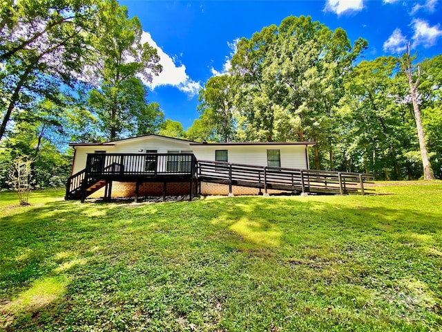 325 Scaley Bark Dr, Salisbury, NC 28147 - rear view of house featuring a deck, a lawn, and stairs