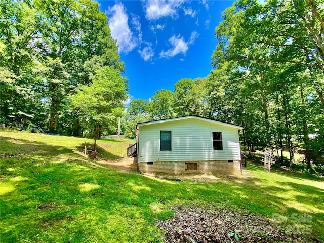 325 Scaley Bark Dr, Salisbury, NC 28147 - view of property exterior featuring crawl space, a yard, and view of scattered trees