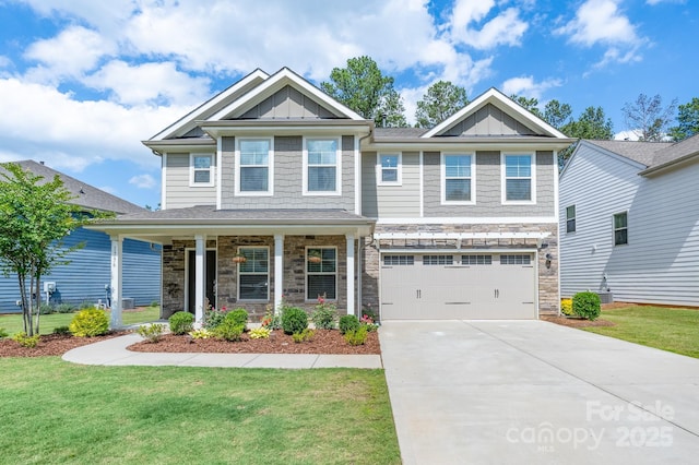 1736 Rhynes Trl, Rock Hill, SC 29732 - craftsman house with board and batten siding, stone siding, driveway, and a front lawn