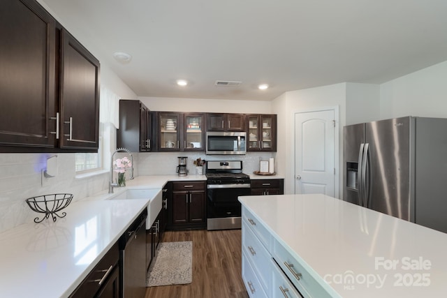 1736 Rhynes Trl, Rock Hill, SC 29732 - kitchen featuring stainless steel appliances, light countertops, dark wood-style flooring, tasteful backsplash, and recessed lighting