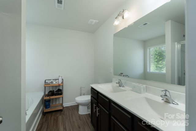 1736 Rhynes Trl, Rock Hill, SC 29732 - bathroom with wood finished floors, a bath, double vanity, and a shower with shower door