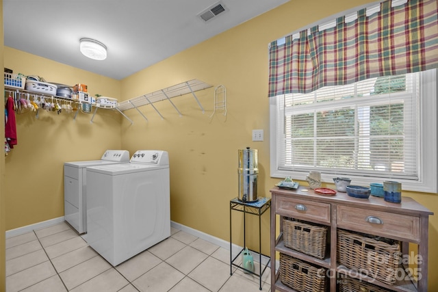 73 Waters Rd, Asheville, NC 28805 - laundry room with independent washer and dryer and light tile patterned floors