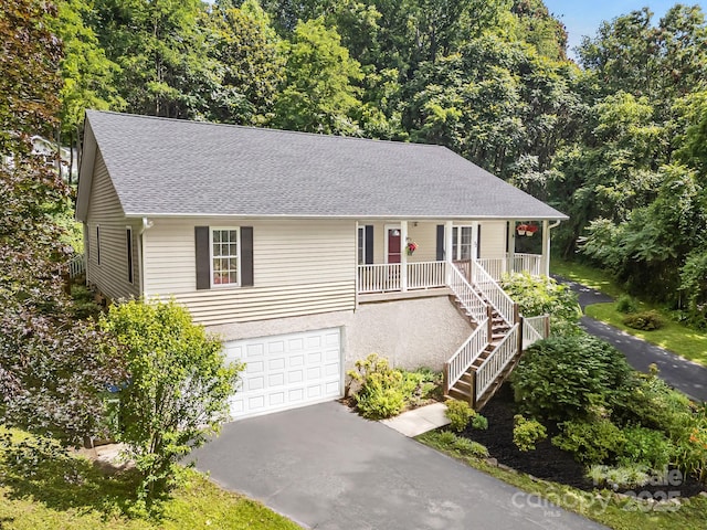 73 Waters Rd, Asheville, NC 28805 - single story home featuring covered porch, asphalt driveway, a garage, stairs, and a shingled roof
