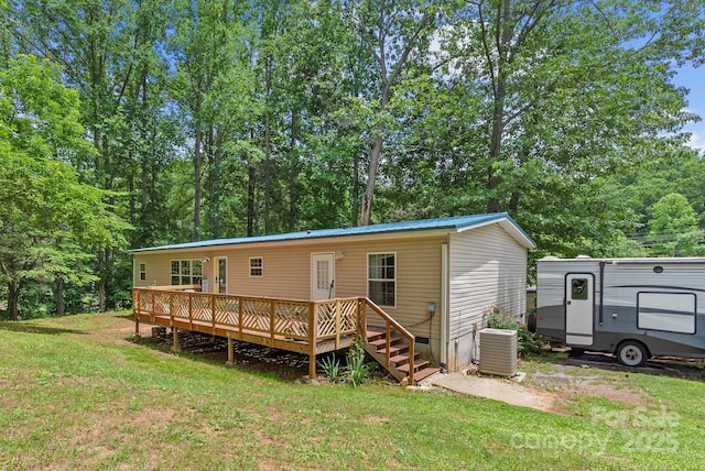 27 Sage Way, Clyde, NC 28721 - rear view of property featuring a yard, a wooden deck, a metal roof, and crawl space