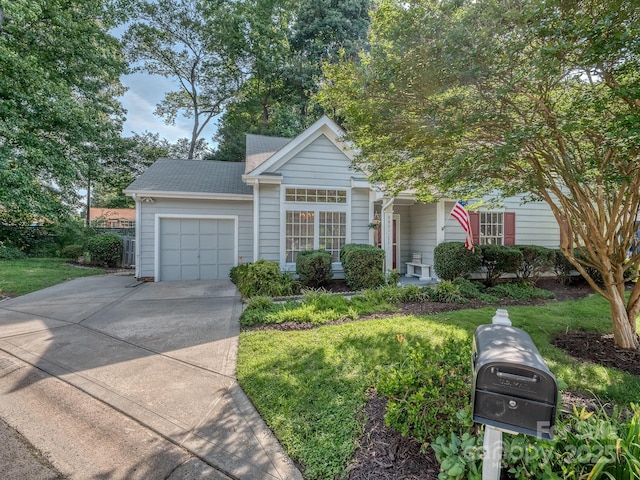 4801 Pennant Pl, Charlotte, NC 28212 - view of front facade with a garage, driveway, a front lawn, and roof with shingles