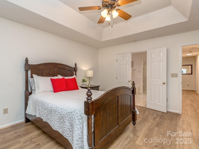 4801 Pennant Pl, Charlotte, NC 28212 - bedroom with light wood finished floors, a raised ceiling, ceiling fan, and attic access