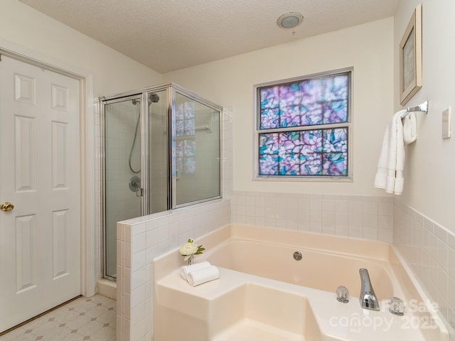 4801 Pennant Pl, Charlotte, NC 28212 - bathroom featuring a stall shower, a garden tub, and a textured ceiling