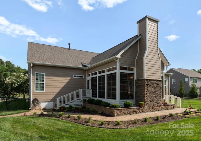 6506 Jepson Ct Unit 349, Charlotte, NC 28214 - back of house with stone siding, a sunroom, a shingled roof, and a chimney