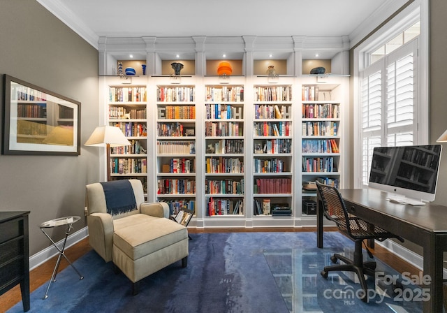 6506 Jepson Ct Unit 349, Charlotte, NC 28214 - home office featuring crown molding, built in shelves, wood finished floors, and wall of books