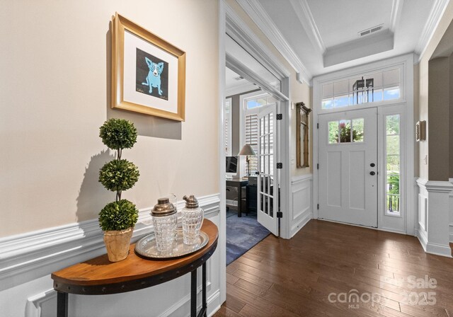 6506 Jepson Ct Unit 349, Charlotte, NC 28214 - entrance foyer with dark wood-type flooring, plenty of natural light, ornamental molding, a tray ceiling, and a wainscoted wall