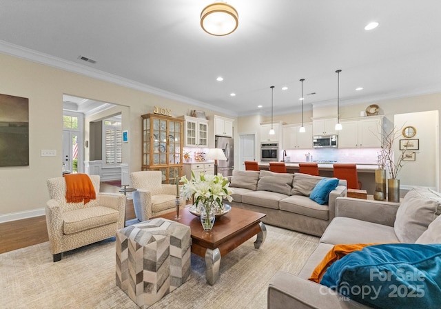 6506 Jepson Ct Unit 349, Charlotte, NC 28214 - living area with light wood-style flooring, ornamental molding, and recessed lighting