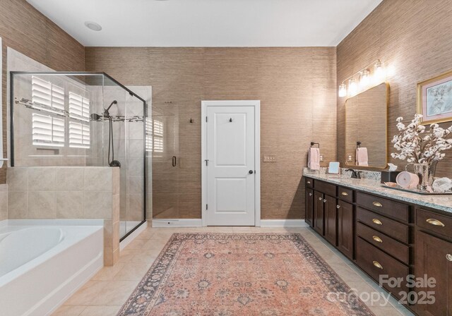 6506 Jepson Ct Unit 349, Charlotte, NC 28214 - bathroom featuring vanity, a garden tub, a shower stall, and tile patterned floors