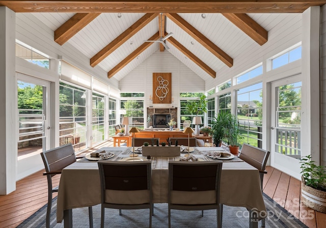 6506 Jepson Ct Unit 349, Charlotte, NC 28214 - sunroom with a fireplace, hardwood / wood-style floors, beam ceiling, high vaulted ceiling, and outdoor dining space