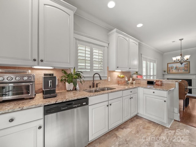 1169 Stuarts Landing Dr, Cramerton, NC 28032 - kitchen featuring stainless steel dishwasher, crown molding, white cabinetry, decorative backsplash, and a peninsula
