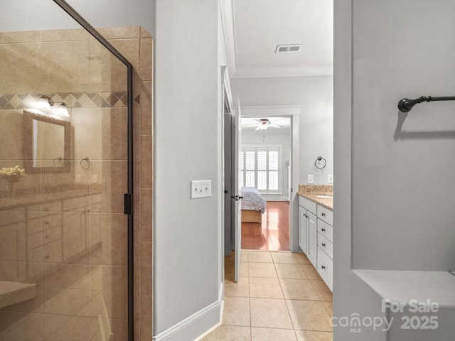 1169 Stuarts Landing Dr, Cramerton, NC 28032 - full bathroom featuring ornamental molding, a stall shower, vanity, tile patterned flooring, and connected bathroom
