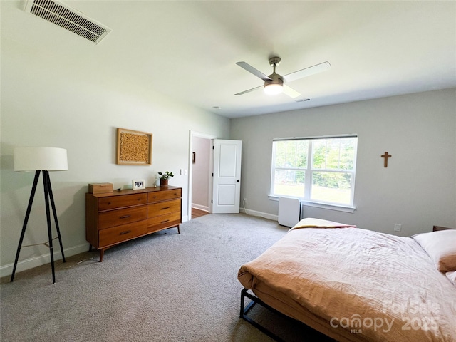 205 Spring Creek Dr, Mount Holly, NC 28120 - carpeted bedroom with baseboards and a ceiling fan