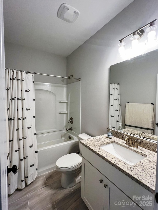 205 Spring Creek Dr, Mount Holly, NC 28120 - full bath with vanity, shower / bath combo, and wood finished floors