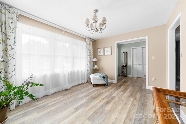 7029 Forest Hills Dr, Denver, NC 28037 - living area featuring a chandelier and light wood-style flooring