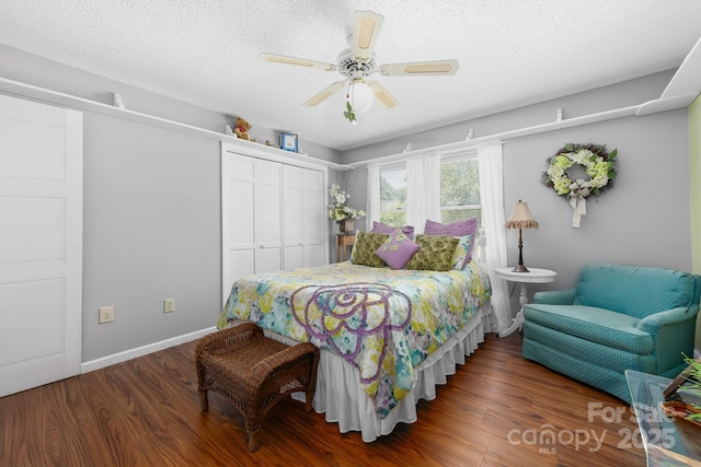 7029 Forest Hills Dr, Denver, NC 28037 - bedroom with a closet, wood finished floors, ceiling fan, and a textured ceiling