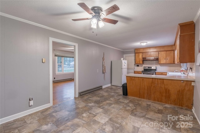 1132 Arbor Dr, Salisbury, NC 28144 - kitchen with freestanding refrigerator, stainless steel electric range, a baseboard radiator, under cabinet range hood, and brown cabinetry
