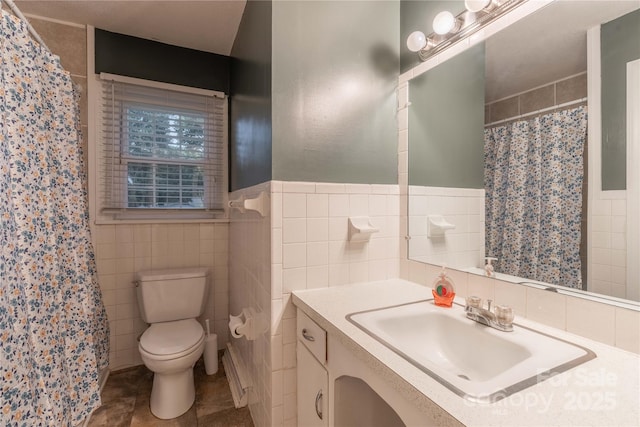 1132 Arbor Dr, Salisbury, NC 28144 - full bath with tile walls, vanity, a shower with shower curtain, and a wainscoted wall