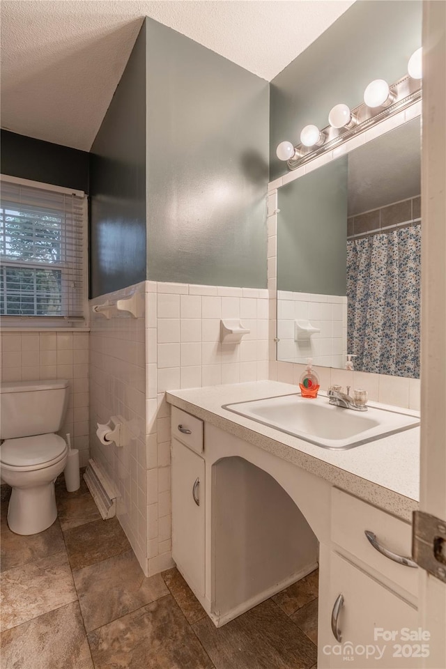 1132 Arbor Dr, Salisbury, NC 28144 - full bathroom featuring tile walls, vanity, and wainscoting