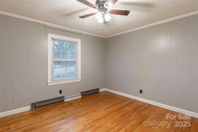 1132 Arbor Dr, Salisbury, NC 28144 - spare room with a baseboard heating unit, light wood-type flooring, a ceiling fan, and crown molding