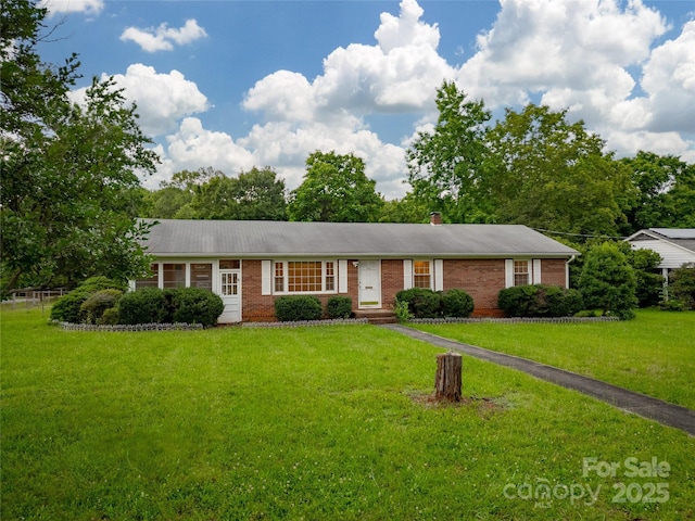 1132 Arbor Dr, Salisbury, NC 28144 - ranch-style home featuring a front lawn, brick siding, a chimney, and entry steps
