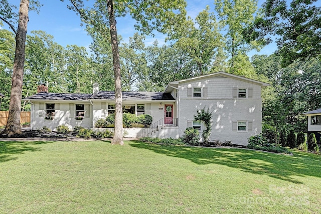 5611 Robinhood Rd, Charlotte, NC 28211 - back of house featuring a chimney and brick siding