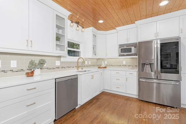 5611 Robinhood Rd, Charlotte, NC 28211 - kitchen with appliances with stainless steel finishes, wooden ceiling, white cabinets, glass insert cabinets, and decorative backsplash