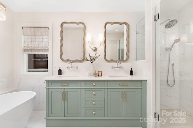 5611 Robinhood Rd, Charlotte, NC 28211 - full bathroom with a marble finish shower, a freestanding bath, double vanity, tile walls, and marble finish flooring