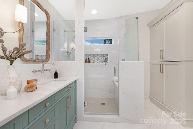 5611 Robinhood Rd, Charlotte, NC 28211 - bathroom featuring a marble finish shower, vanity, marble finish flooring, and recessed lighting