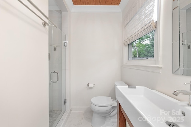 5611 Robinhood Rd, Charlotte, NC 28211 - bathroom featuring crown molding, vanity, a stall shower, and marble look tiles
