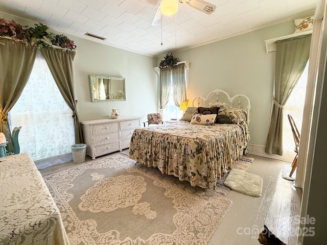 192 W Court St, Rutherfordton, NC 28139 - bedroom with ornamental molding, light wood finished floors, and a ceiling fan