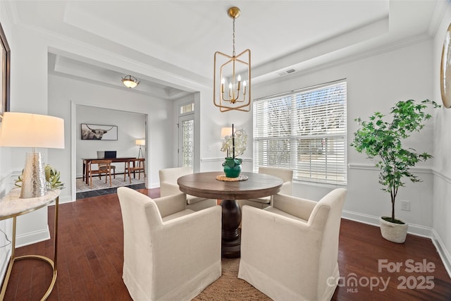 8312 Compton Acres Ln, Waxhaw, NC 28173 - dining room with plenty of natural light, dark wood-style flooring, a chandelier, a raised ceiling, and ornamental molding