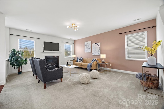 8312 Compton Acres Ln, Waxhaw, NC 28173 - living area with carpet floors, plenty of natural light, and a glass covered fireplace